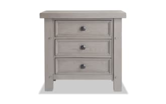 Hudson Gray 3 Drawer Nightstand in rustic transitional style with rubberwood, pine, and mango veneers. Features pewter-finish metal hardware.