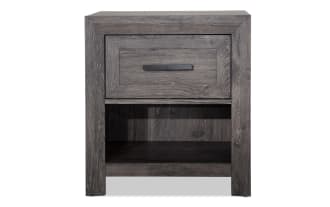 Calvin Gray Nightstand with Drawer from Calvin Bedroom collection, featuring engineered wood grain, contemporary style, gray finish, felt-lined drawer, and open lower shelf for versatile storage.