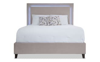 Performa Full Beige Upholstered Panel Bed with plush polyester fabric, rubberwood frame, and built-in LED lighting in contemporary style.