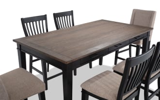 Montana 7 Piece Black & Beige Upholstered Counter Height Dining Set with rustic rubberwood and oak veneer top, beige polyester fabric chairs, and six storage drawers.