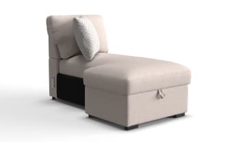 Beige fabric chaise lounge with cushioned backrest and patterned throw pillow, featuring a modern design and compact size for living room seating.