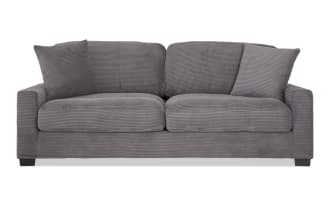 Aspen Charcoal 86'' sofa in gray polyester fabric with plush corduroy texture, transitional style, memory foam cushions, and included accent pillows.
