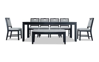 Brookline 8 Piece Black & White Upholstered Dining Set with storage bench, featuring a black MDF and solid wood table, white polyester fabric cushions, and transitional style.