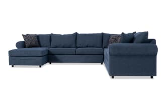 Juno Denim 142'' 4 Piece Left Arm Facing Chaise Sectional in blue polyester fabric with transitional style, memory foam cushions, and patterned accent pillows.