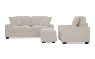 Beige corduroy fabric living room set including a two-seater sofa, armchair, and ottoman with dark wooden legs, showcasing modern comfort and style.