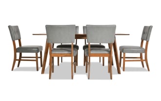 Bettie 7 Piece Walnut & Charcoal Faux Leather Dining Set with mid-century modern style, gray faux leather upholstery, flared walnut legs, and memory foam seats.