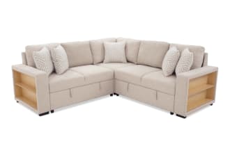 Beige fabric sectional sofa with corner design, featuring built-in wooden side shelves and patterned throw pillows, ideal for modern living rooms.