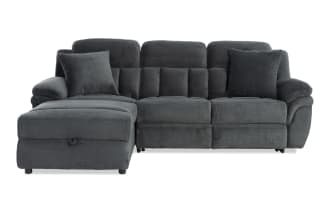 Dark gray fabric sectional sofa with plush cushions, padded armrests, and a left chaise lounge, designed for modern living rooms.