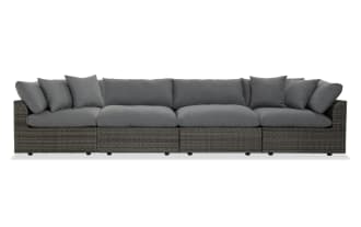 Dream 4 Piece Gray Wicker Outdoor Sectional with modular design, gray all-weather wicker, aluminum frame, and reversible polyester cushions.
