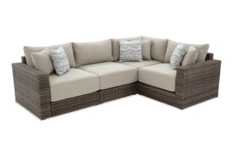 Modular Bob® 4 Piece Beige & Brown Wicker Outdoor Conversation Set with all-weather wicker, rust-proof aluminum frame, and beige polyester cushions in transitional style.