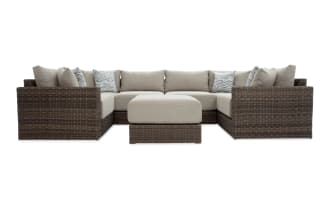 Modular Bob® 7 Piece Beige & Brown Wicker Outdoor Conversation Set with Ottoman, transitional style, all-weather wicker, rust-proof aluminum frame, beige polyester cushions with memory foam, versatile sectional for outdoor spaces.