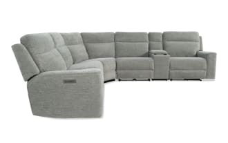 Gray fabric sectional recliner sofa with adjustable headrests, cup holder console, and plush cushioning designed for living room comfort.