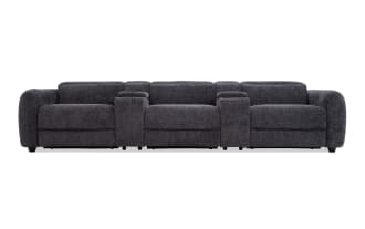 Dark gray fabric reclining sectional sofa with plush cushions and wide armrests, designed for modern living room comfort and style.