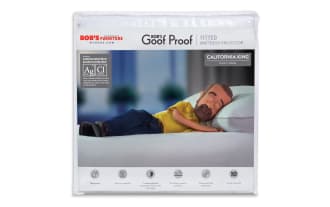 Bob's Discount Furniture Goof Proof mattress and pillow protectors in white, featuring antimicrobial silver protection, waterproof, machine washable, with 10-year warranty. Includes California King total encasement and fitted mattress protectors, plus King-size pillow protectors.