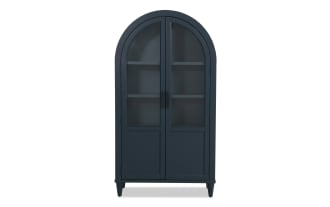 Domus Navy Arch Cabinet in transitional style with navy rubberwood and MDF, featuring arched top, glass doors, and sleek black handles for stylish storage.