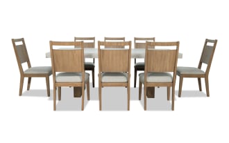 Monterey 9 Piece Natural & Gray Panel Back Upholstered Dining Set with faux concrete melamine table top, gray polyester fabric chairs, traditional style.