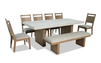Monterey 8 Piece Natural & Gray Panel Back Upholstered Dining Set with bench, gray polyester fabric, faux concrete melamine tabletop, traditional style.