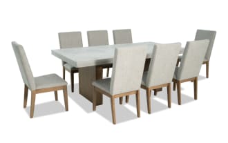Monterey 9 Piece Natural & Gray Dining Set with gray fabric polyester upholstery, solid back chairs, and faux concrete melamine tabletop in traditional style.
