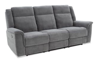 Gray fabric reclining sofa with three seats, padded armrests, and cushioned backrests, designed for living room comfort and style.