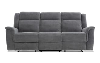 Gray fabric reclining sofa with three seats, padded armrests, and cushioned backrests, designed for living room comfort and style.