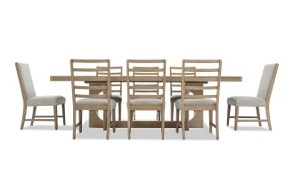 Dining table set with a rectangular wooden table and eight matching chairs featuring light beige upholstered seats and ladder-back design, ideal for modern dining rooms.