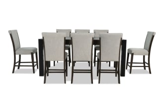 Aurora 9 Piece Brown & Black solid back extendable counter height dining set with gray polyester fabric seats, MDF and rubberwood frame, transitional style, featuring two lift-top storage compartments and memory foam stools.