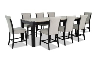 Aurora 9 Piece Gray & Black Solid Back Extendable Storage Counter Height Dining Set with polyester fabric upholstery, MDF and rubberwood solids, transitional style, includes 8 gray cushioned stools with memory foam and an extendable gray and black table with dual lift-top storage compartments.