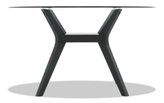 Modern round glass dining table with black wooden angled legs and central support beam, showcasing contemporary minimalist design.