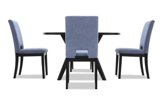 Dining set with a black rectangular table and four upholstered chairs in blue fabric, featuring wooden legs and a modern design.