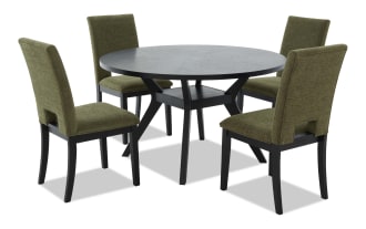 Round black wooden dining table with four olive green upholstered chairs featuring black wooden legs, suitable for modern dining rooms.