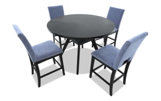 Dining set with a black wooden table and four blue upholstered chairs featuring cushioned seats and backs, modern design.