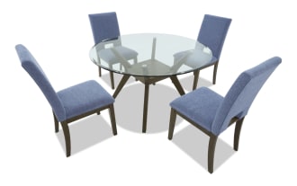 Modern dining set with a rectangular glass top table and four blue upholstered chairs featuring wooden legs and a contemporary design.