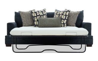 Dark blue fabric sofa bed with black metal frame pull-out mattress, featuring five decorative patterned cushions in neutral tones, modern design.