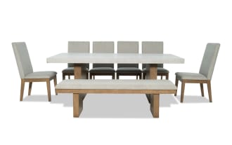 Monterey 8 Piece Natural & Gray Solid Back Upholstered Dining Set with Bench, traditional style with gray polyester fabric, faux concrete melamine tabletop, MDF and hardwood solids, includes six memory foam chairs and matching bench.