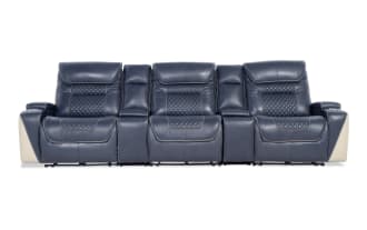 Blue leather reclining home theater sofa with quilted stitching, beige accents, padded armrests, and cup holders, designed for comfort and style.