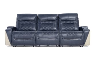 Blue leather reclining three-seat sofa with quilted backrests, white side panels, and cup holders on armrests, modern design.