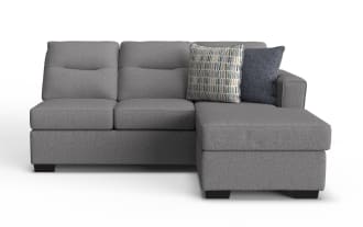 Dylan Slate Right Arm Facing Sofa & Chaise Kit in gray polyester fabric, transitional style with memory foam cushions, featuring two patterned throw pillows.
