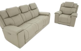 Beige leather reclining sofa and armchair set with padded armrests and headrests, designed for living room comfort and style.