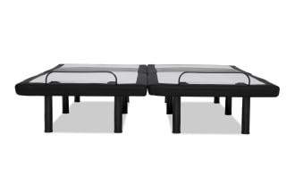 Adjustable black metal bed frame foundation with mesh center support and protective footboard rails, designed for mattress stability and durability.