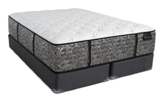 Mattress and foundation set with a gray and white patterned mattress labeled "DISTINCTION" and a dark gray fabric foundation base with "BOB'S" tags.