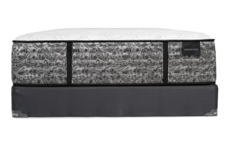 Mattress and box spring set with a white quilted top and gray patterned sides, labeled "DISTINCTION," featuring black trim and a dark gray fabric base.