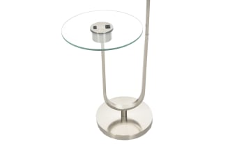 Modern floor lamp with brushed nickel finish, white drum shade, and built-in round glass side table, ideal for living room lighting and decor.