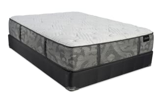 Zeus mattress with gray patterned fabric sides, white quilted top, and black base, designed for comfort and support.