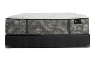 Zeus mattress with gray patterned fabric sides, white quilted top, and black base, designed for comfort and support.