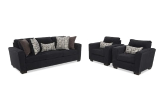 Black fabric living room sofa set with a three-seat couch and two armchairs, featuring plush cushions and patterned throw pillows.