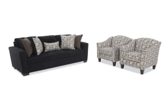 Dark fabric sofa with plush cushions and two patterned armchairs featuring a modern geometric design, ideal for contemporary living rooms.