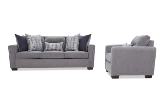 Gray fabric sofa with dark wooden legs, featuring three seat cushions and six decorative pillows in blue and gray patterns, shown from front and side views.
