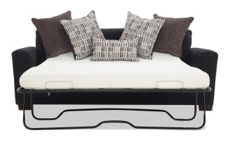 Black fabric sofa bed with a white mattress and five decorative pillows in brown and patterned beige tones, featuring a metal frame for mattress support.