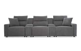 Modern gray fabric three-seat reclining sofa with padded armrests, adjustable headrests, and two matching throw pillows, ideal for living room comfort.