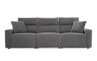 Modern gray fabric reclining sofa with three seats, high back cushions, and two matching throw pillows, ideal for living room comfort.